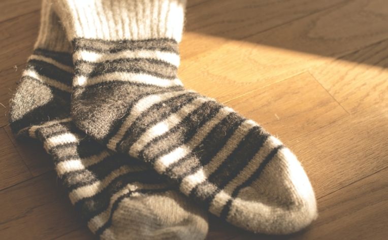 Socks Lying on Clean Hardwood Flooring